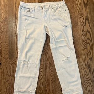 Distressed white jeans